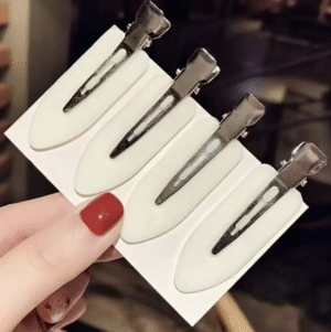 PINZA PARA SOSTENER EL CABELLO COLOR BLANCO